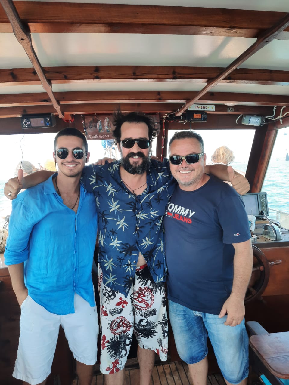 Captains of Amvrakikos Cruises with a Greek celebrity guest